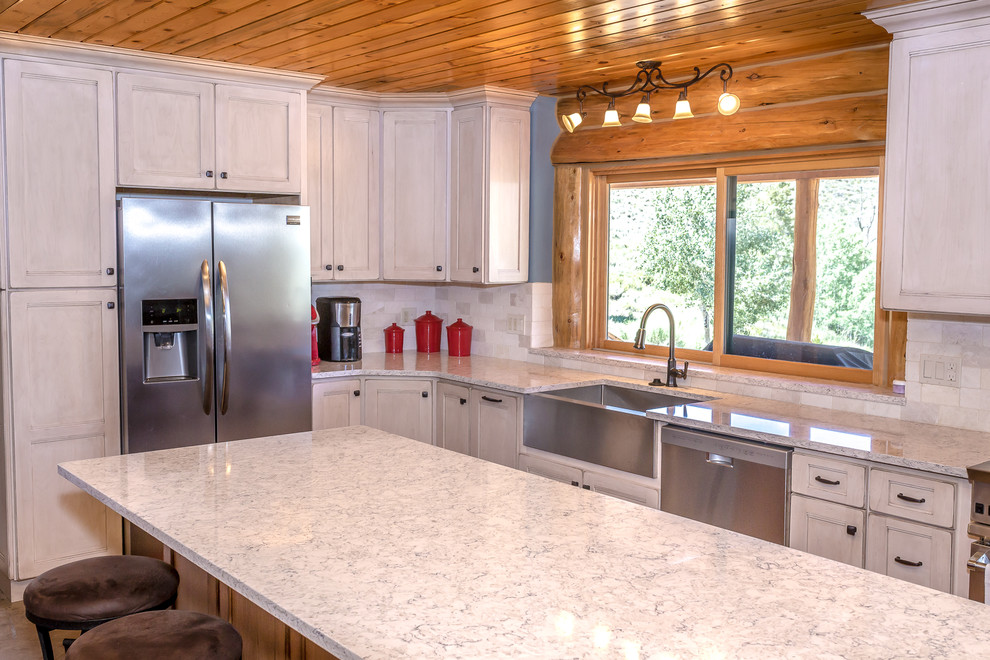 Mid-sized mountain style l-shaped beige floor enclosed kitchen photo in Denver with a farmhouse sink, medium tone wood cabinets, granite countertops, white backsplash, stainless steel appliances, an island and gray countertops