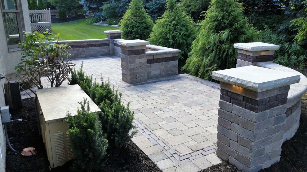 Inspiration for a mid-sized contemporary backyard patio in Columbus with concrete pavers and no cover.