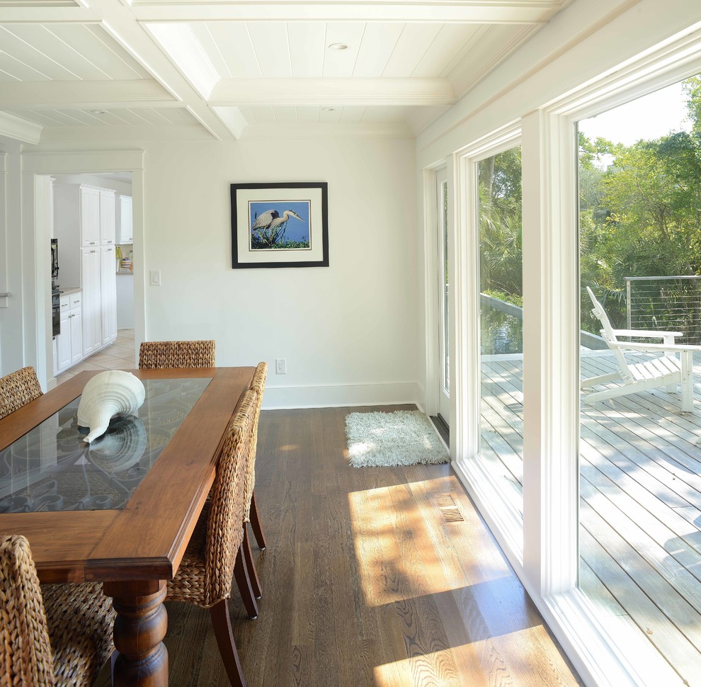Design ideas for a small beach style separate dining room in Charleston with white walls and medium hardwood floors.