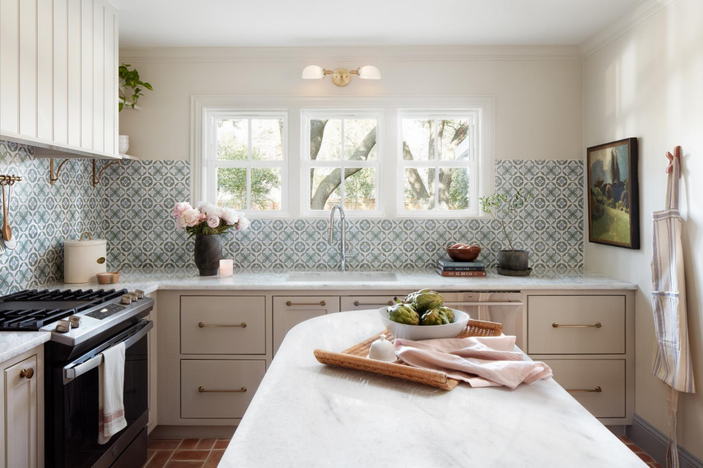 Inspiration for a transitional kitchen remodel in Austin with marble countertops, green backsplash, marble backsplash, an island and white countertops