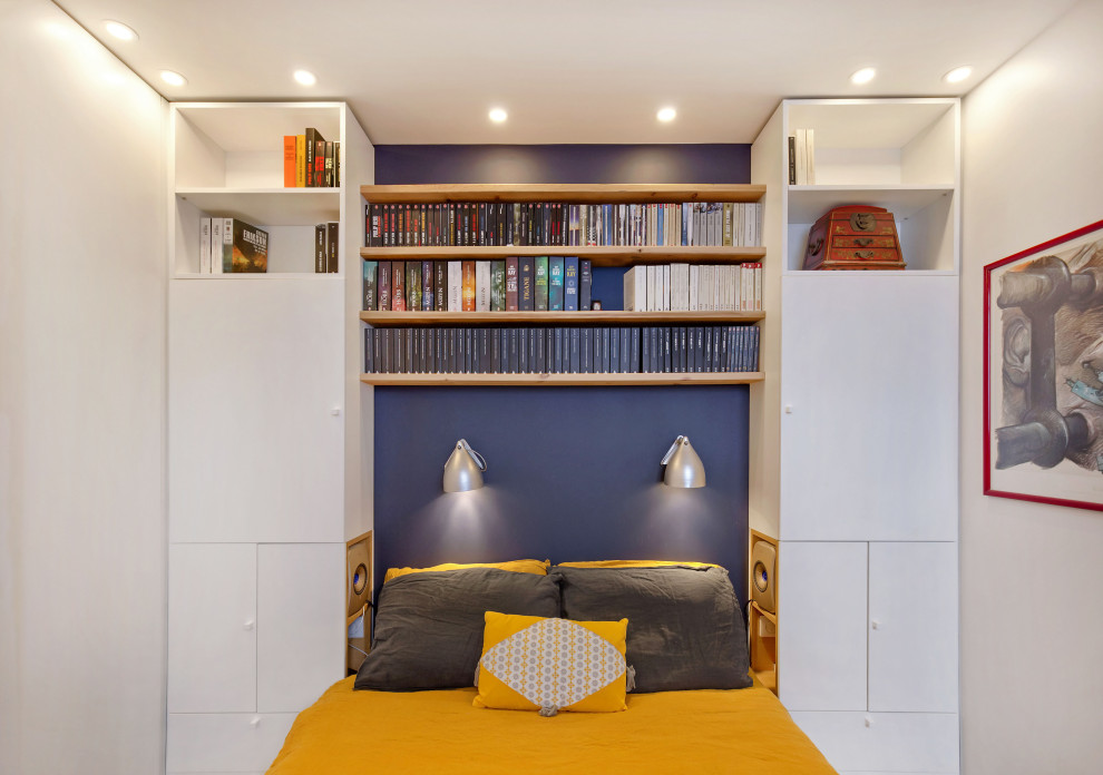 Bedroom - small industrial master bedroom idea in Paris with blue walls