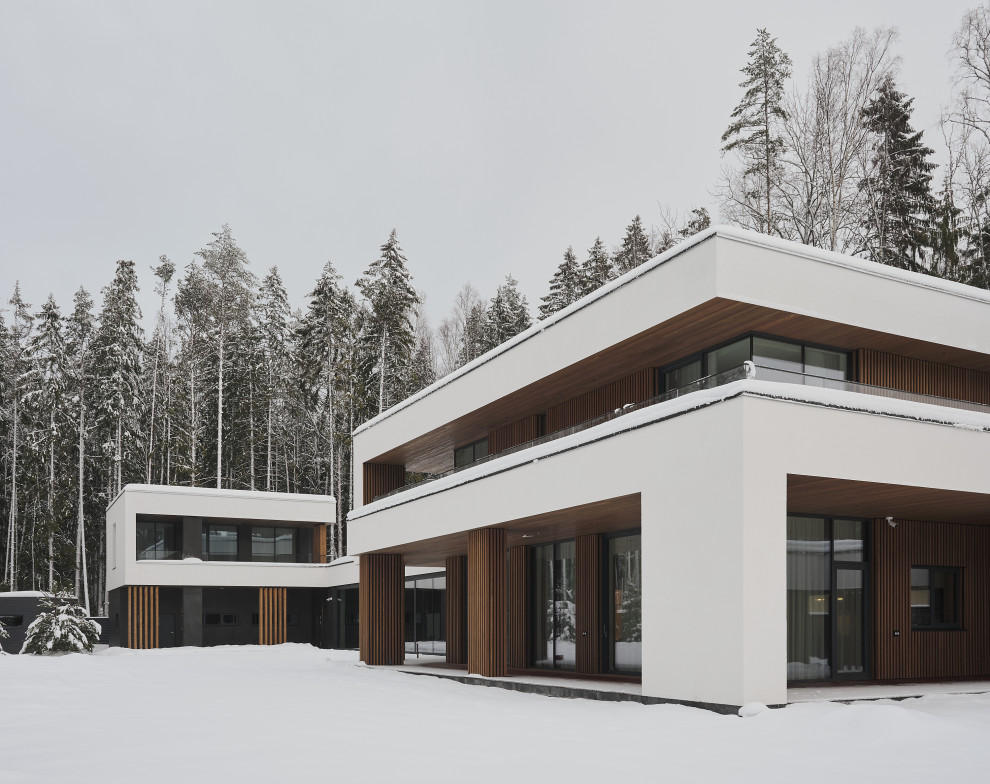 Inspiration for a large and white contemporary two floor detached house in Saint Petersburg with mixed cladding, a flat roof, a mixed material roof, a black roof and shiplap cladding.