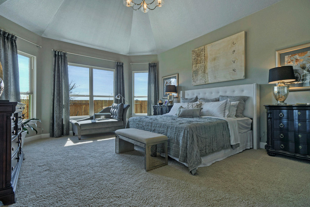 Large traditional master bedroom in Austin with grey walls, carpet and no fireplace.