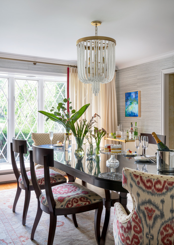 Photo of a transitional dining room in Boston with wallpaper.