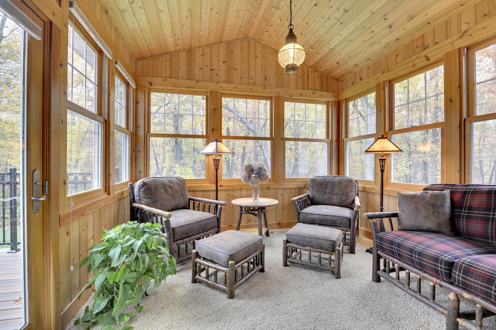 Photo of a mid-sized country sunroom in Minneapolis with carpet and a standard ceiling.