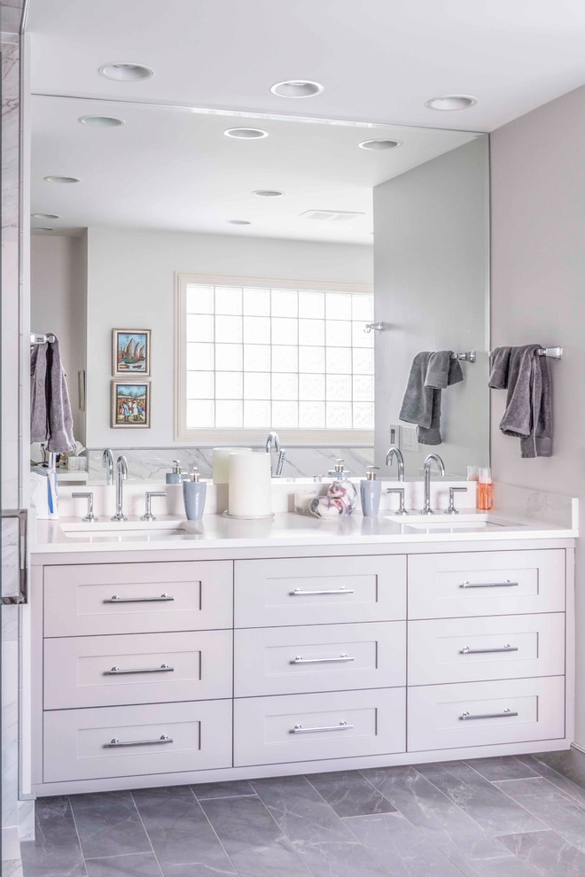 Mid-sized transitional 3/4 medium tone wood floor and brown floor bathroom photo in Calgary with furniture-like cabinets, white cabinets and an undermount sink