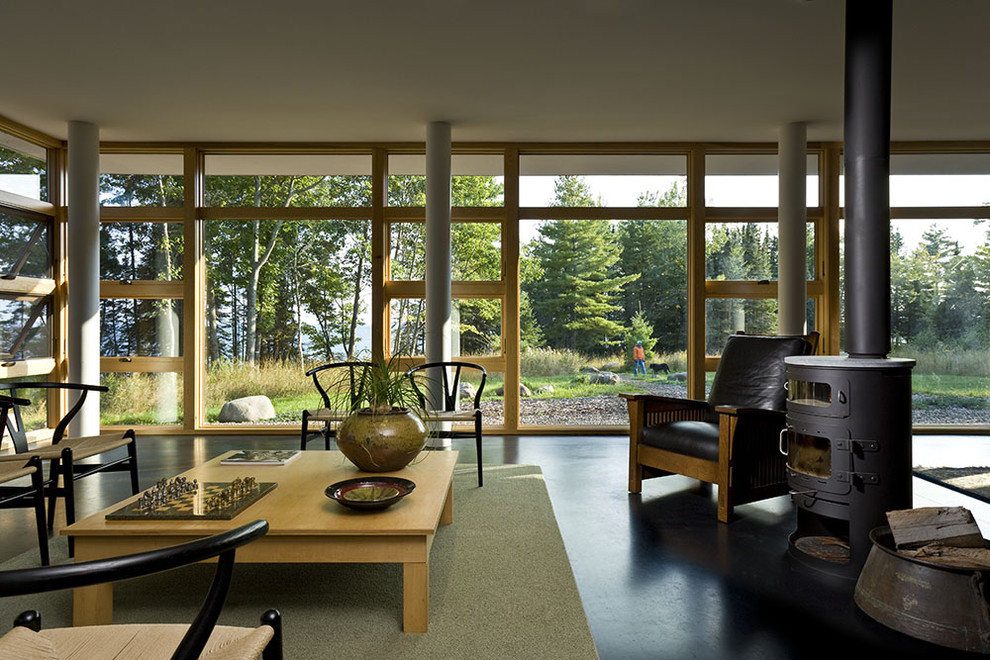 Inspiration for a modern open concept living room in Minneapolis with a wood stove.