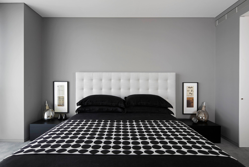 This is an example of a mid-sized contemporary master bedroom in Sydney with grey walls and carpet.