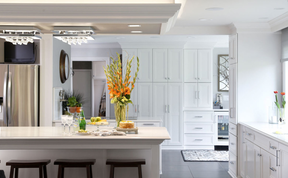 Inspiration for a transitional porcelain tile and gray floor kitchen remodel in Cedar Rapids with recessed-panel cabinets, white cabinets and glass countertops