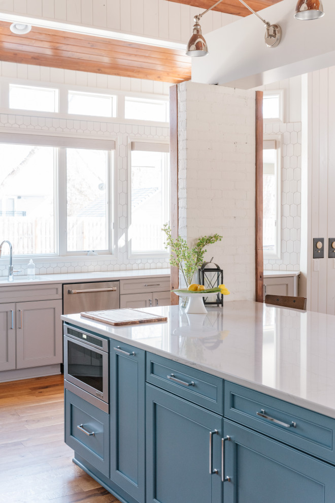 Large transitional kitchen photo in Omaha with an island