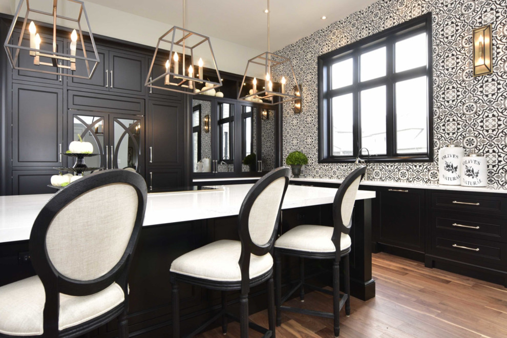 Inspiration for a large transitional l-shaped medium tone wood floor and brown floor eat-in kitchen remodel with an undermount sink, recessed-panel cabinets, black cabinets, marble countertops, multicolored backsplash, cement tile backsplash, paneled appliances and an island