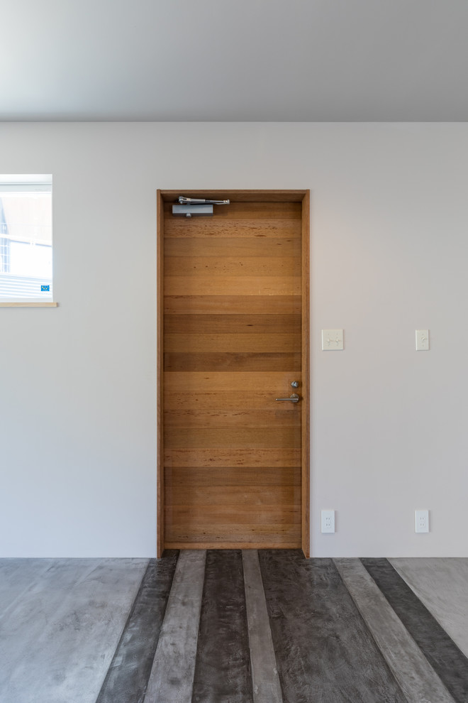 This is an example of a contemporary entryway in Other.