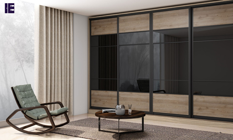 Mid-sized contemporary built-in wardrobe in London with glass-front cabinets and medium wood cabinets.