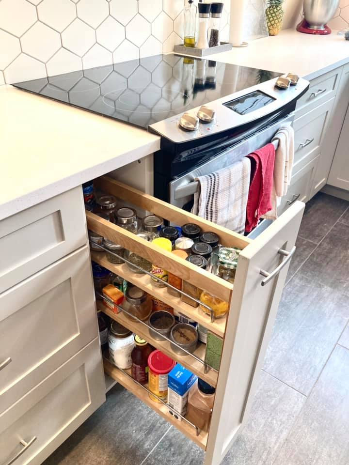 Enclosed kitchen - mid-sized transitional u-shaped vinyl floor and gray floor enclosed kitchen idea with an undermount sink, shaker cabinets, beige cabinets, quartz countertops, white backsplash, ceramic backsplash, stainless steel appliances and white countertops