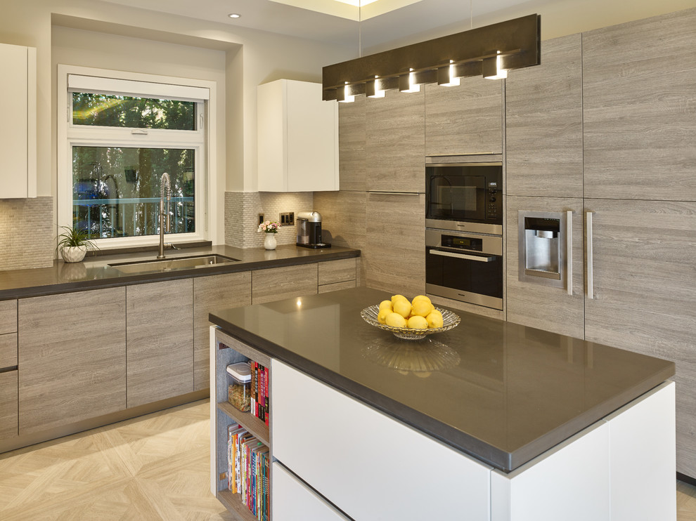 This is an example of a mid-sized contemporary u-shaped eat-in kitchen in Vancouver with an undermount sink, flat-panel cabinets, light wood cabinets, granite benchtops, grey splashback, stone tile splashback, stainless steel appliances, porcelain floors and with island.