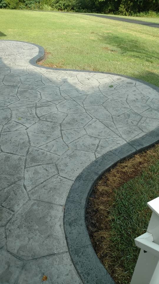 Design ideas for a large traditional backyard patio in Other with a fire feature, stamped concrete and no cover.