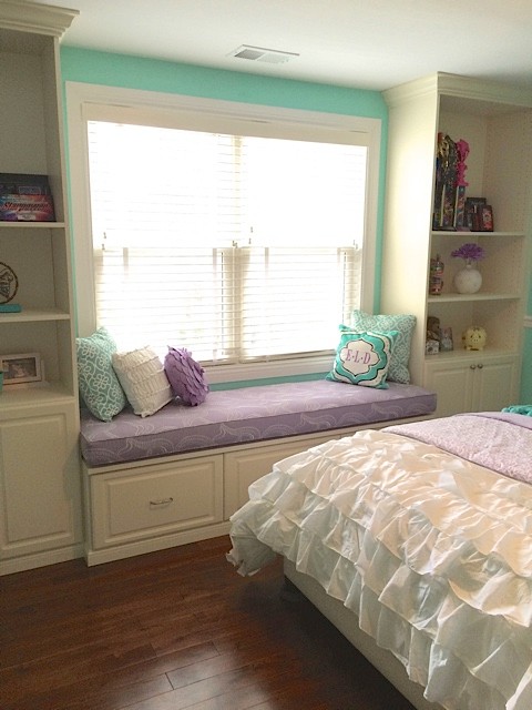 Mid-sized transitional bedroom in DC Metro with green walls and medium hardwood floors.