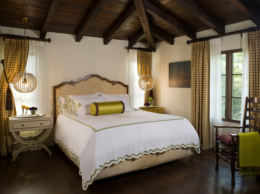 Design ideas for a mediterranean bedroom in Los Angeles with white walls and dark hardwood floors.