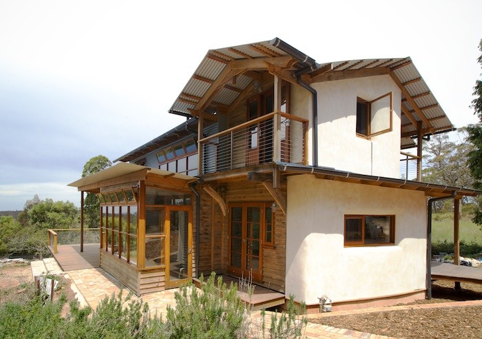 This is an example of a mid-sized country home design in Sydney.