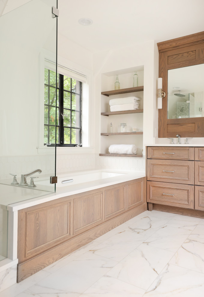 Design ideas for a large traditional ensuite bathroom in Chicago with recessed-panel cabinets, light wood cabinets, white tiles, porcelain flooring, engineered stone worktops, white floors, white worktops, a wall niche, double sinks and a built in vanity unit.