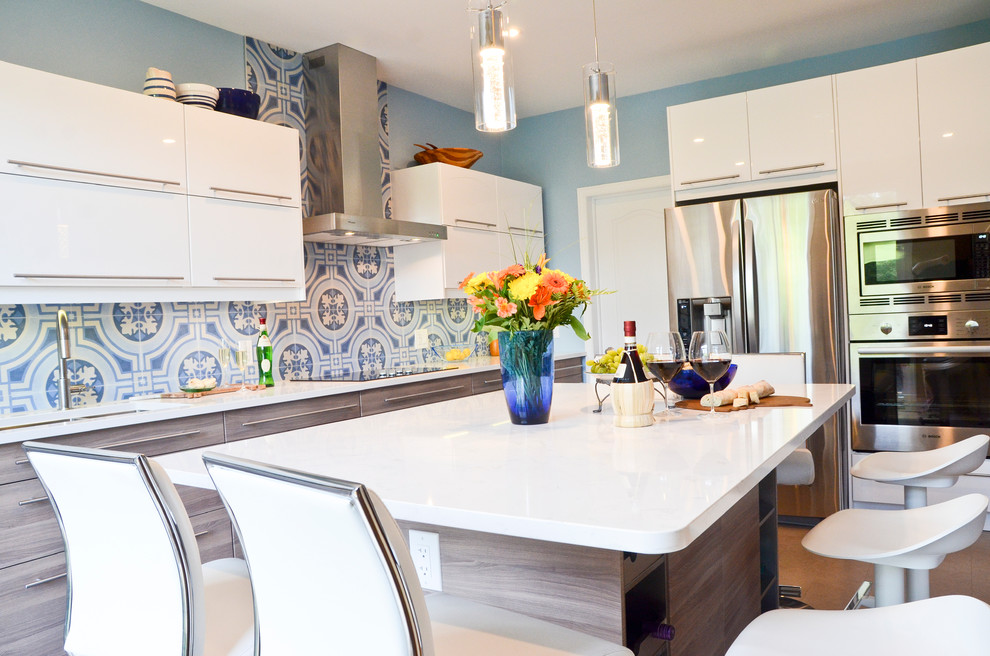 Inspiration for a mid-sized modern l-shaped cork floor eat-in kitchen remodel in Ottawa with an undermount sink, flat-panel cabinets, white cabinets, quartzite countertops, blue backsplash, porcelain backsplash, stainless steel appliances and an island