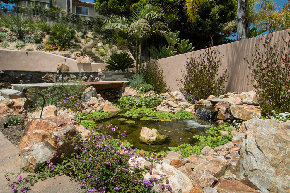 Photo of a traditional garden in San Diego with a water feature.