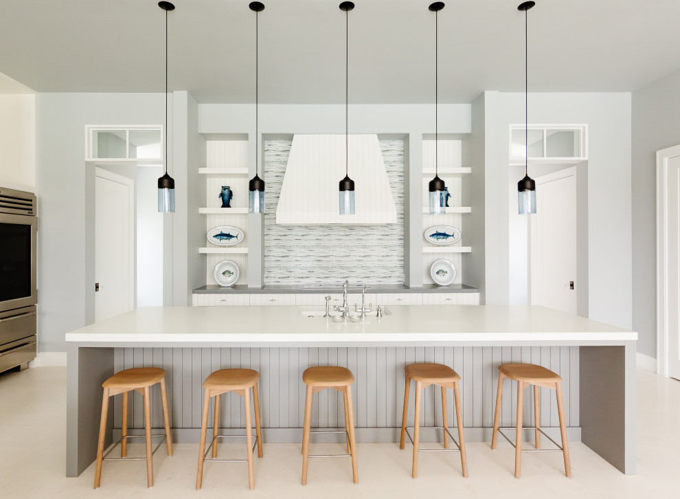 Transitional kitchen photo in Tampa with an island