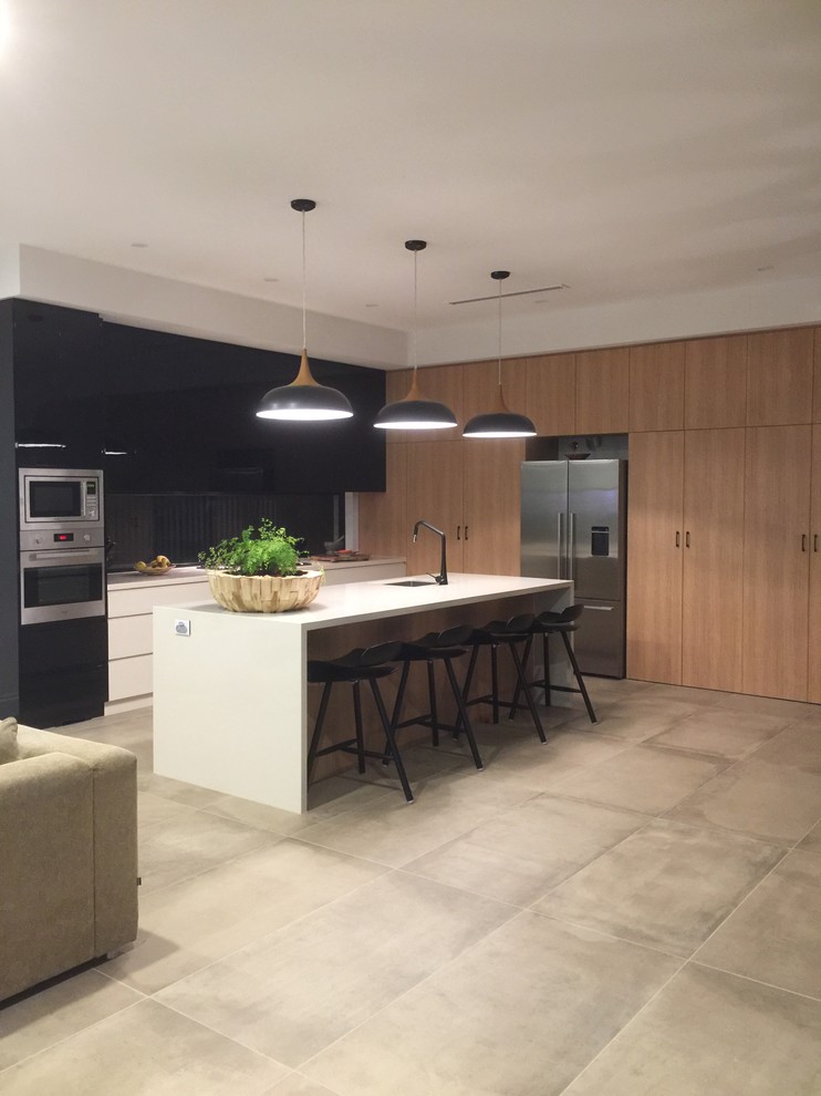 Design ideas for a contemporary kitchen in Adelaide with a single-bowl sink, quartz benchtops and stainless steel appliances.