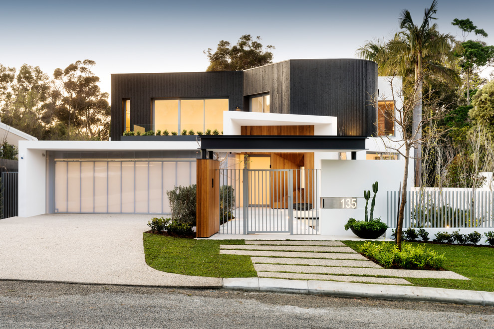 Inspiration for a contemporary two-storey multi-coloured duplex exterior in Perth with wood siding and a flat roof.