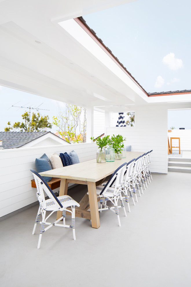 Beach style rooftop and rooftop deck in Los Angeles with a roof extension.