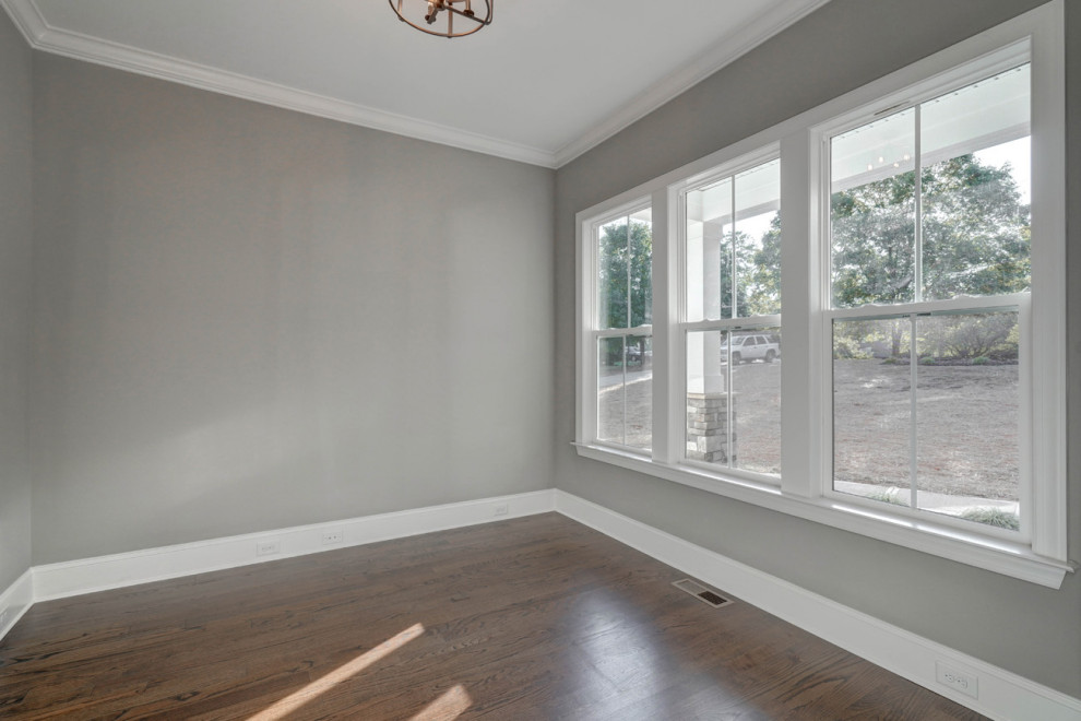 Example of a transitional home design design in Charlotte