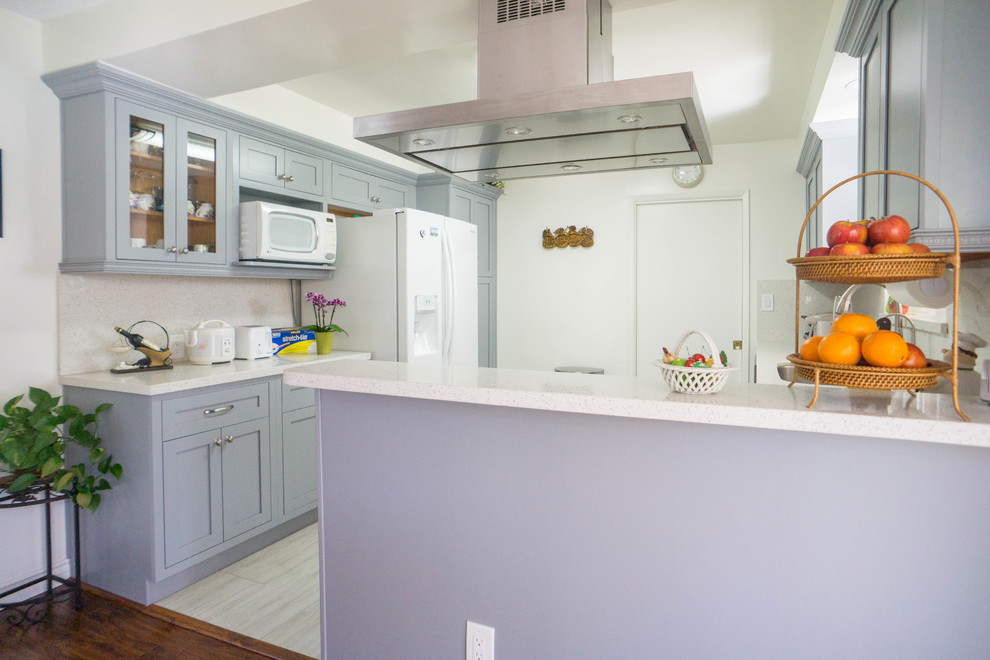 Inspiration for a mid-sized transitional l-shaped porcelain tile and white floor enclosed kitchen remodel with an undermount sink, shaker cabinets, gray cabinets, quartz countertops, white backsplash, stone slab backsplash, stainless steel appliances, no island and white countertops