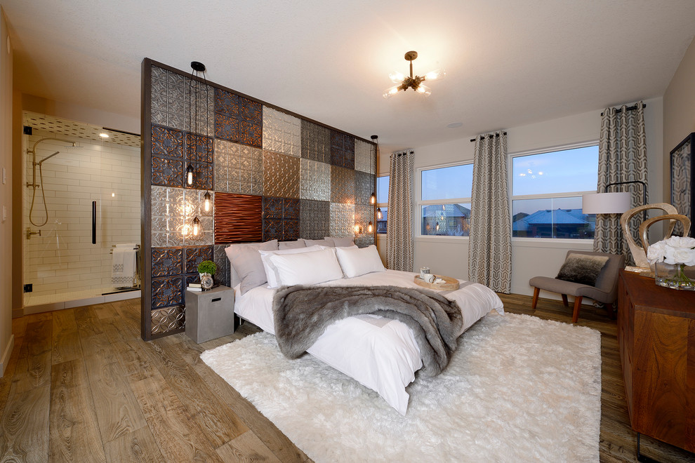 Industrial master bedroom in Edmonton with grey walls, dark hardwood floors and brown floor.