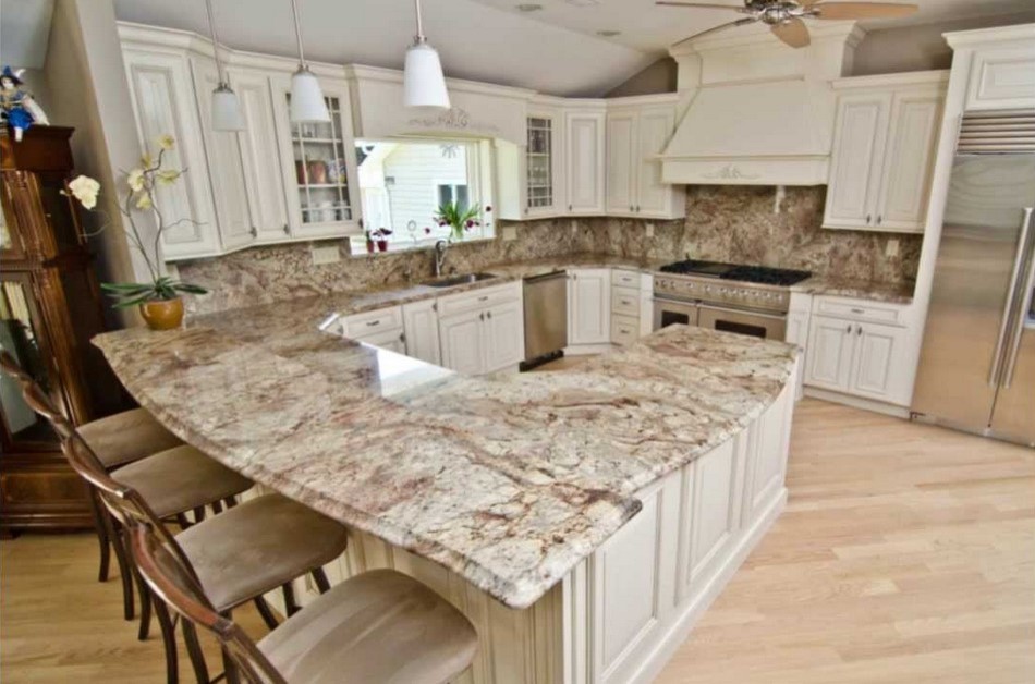 Inspiration for a mid-sized transitional u-shaped light wood floor eat-in kitchen remodel with a double-bowl sink, raised-panel cabinets, white cabinets, granite countertops, multicolored backsplash and a peninsula