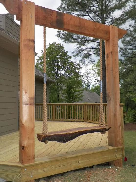 Example of a mid-sized mountain style backyard deck design in Birmingham with no cover