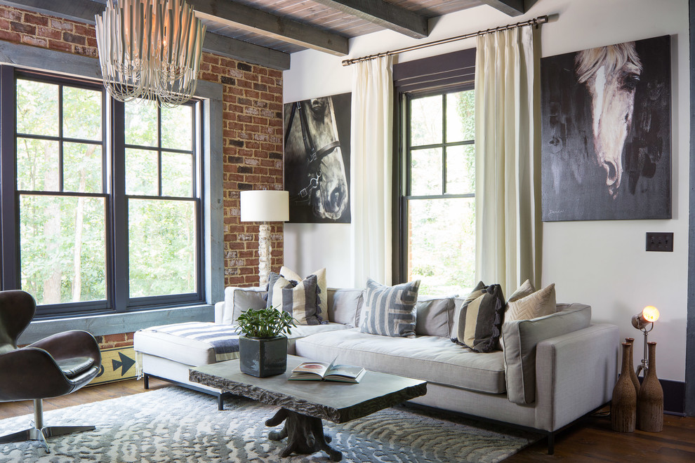 Design ideas for a large industrial open concept living room in Atlanta with white walls, dark hardwood floors and brown floor.