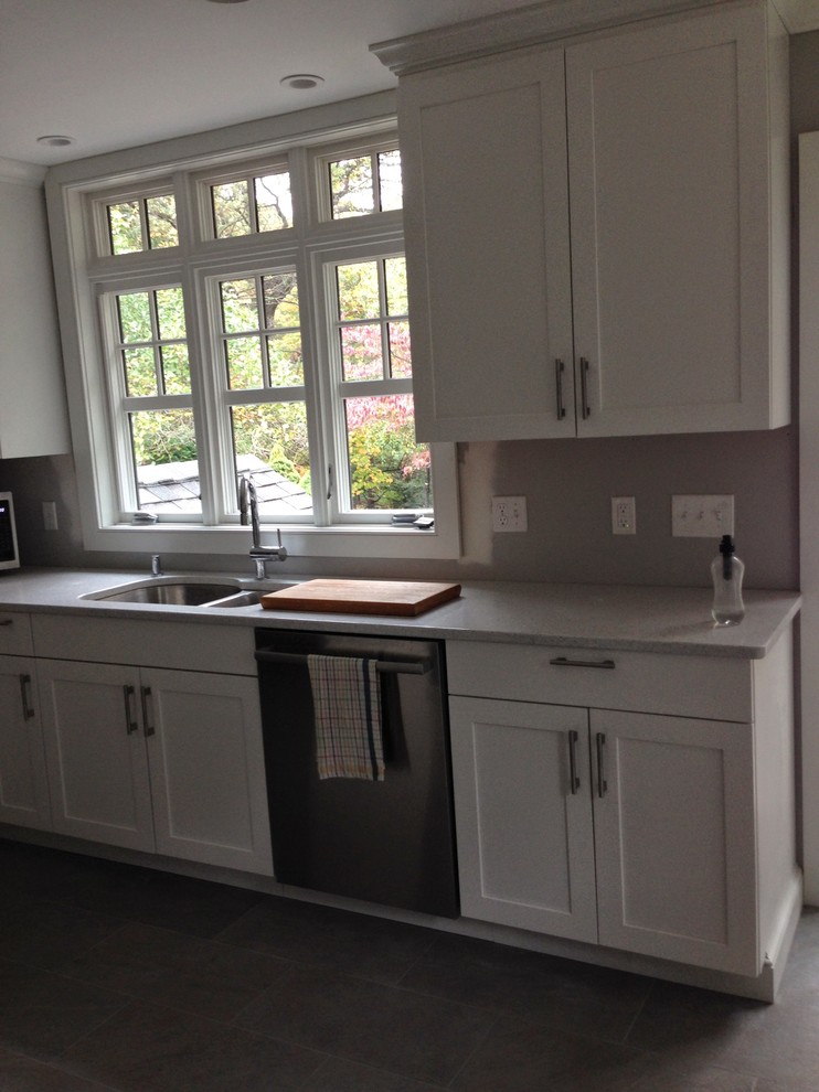 Design ideas for a small traditional l-shaped eat-in kitchen in Boston with a double-bowl sink, shaker cabinets, white cabinets, quartz benchtops, stainless steel appliances, slate floors and no island.