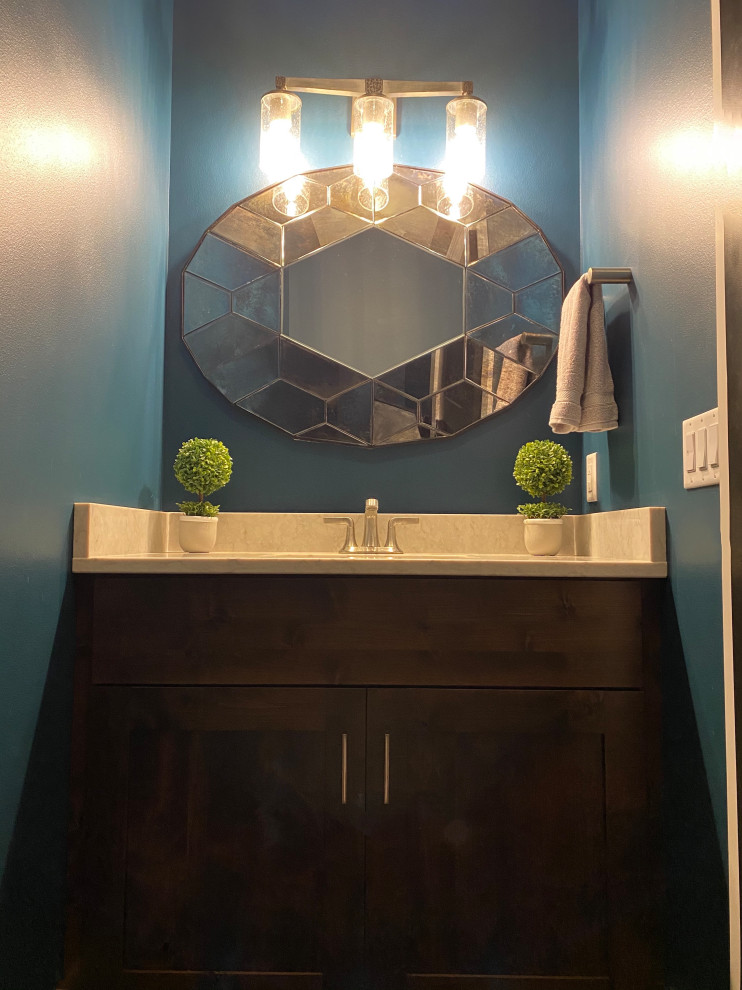 Inspiration for a country powder room in Chicago with shaker cabinets, brown cabinets, blue walls and a built-in vanity.