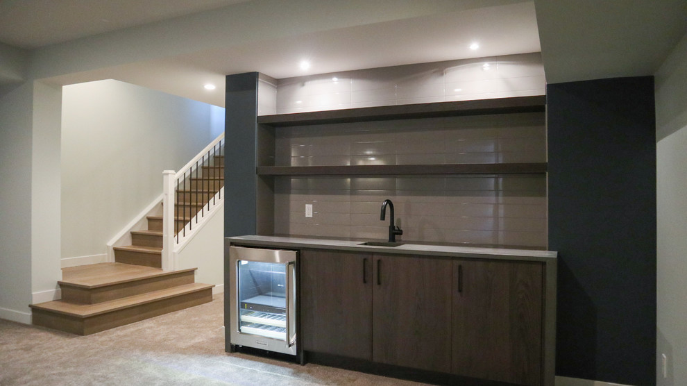 Inspiration for a large transitional underground carpeted and gray floor basement remodel in Calgary with gray walls