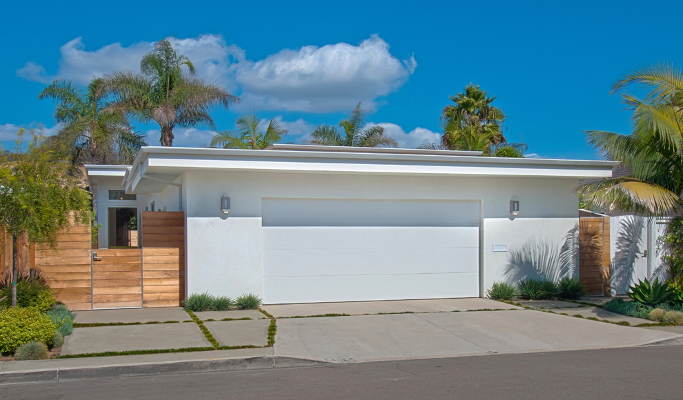 Photo of a beach style attached garage in Orange County.