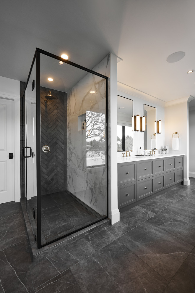 Inspiration for a large transitional master bathroom in Vancouver with shaker cabinets, grey cabinets, a freestanding tub, an alcove shower, white walls, porcelain floors, an undermount sink, quartzite benchtops, grey floor, a hinged shower door and white benchtops.