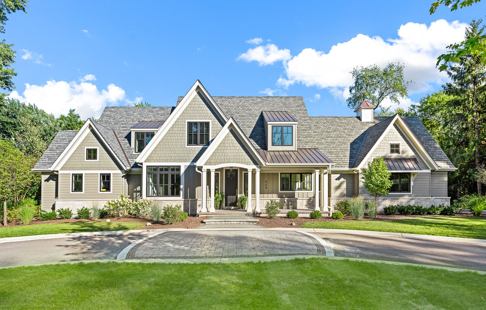 Traditional grey house exterior in Chicago with a gable roof.