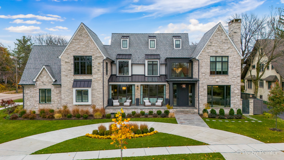 Large transitional white three-story concrete fiberboard and board and batten gable roof photo in Chicago with a tile roof and a gray roof