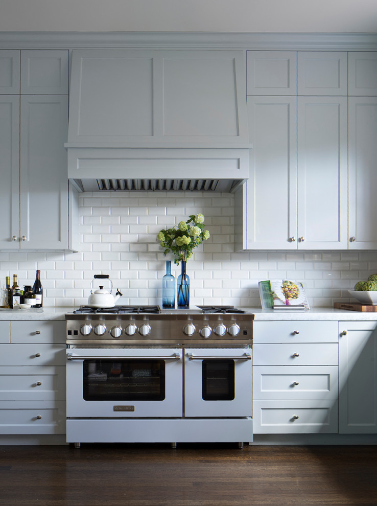 Kitchen - transitional brown floor kitchen idea in San Francisco with granite countertops and an island