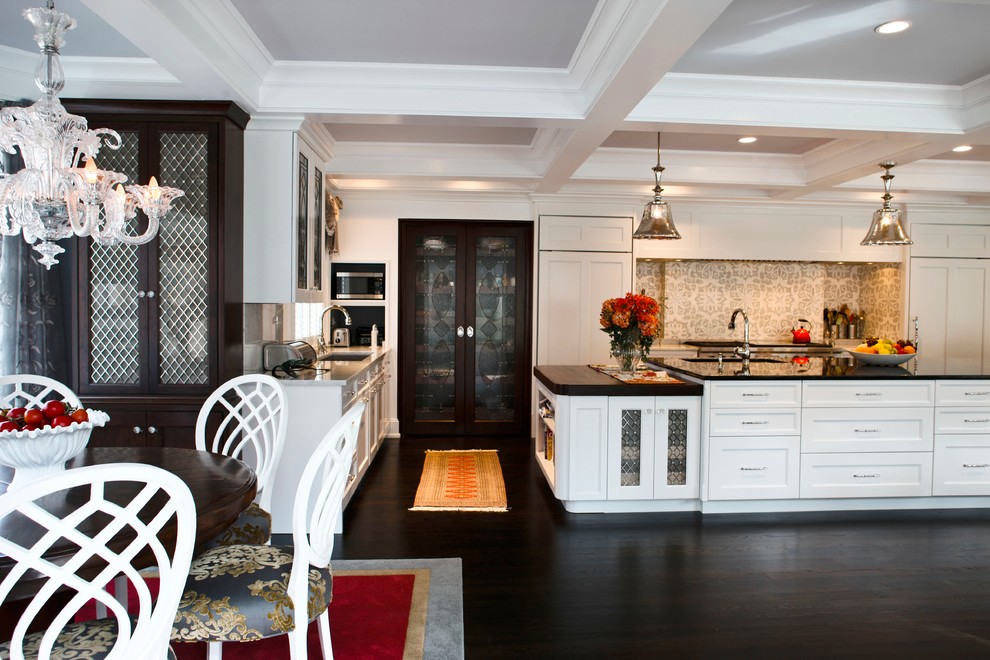 Inspiration for a large transitional kitchen in Philadelphia with white cabinets, dark hardwood floors and with island.
