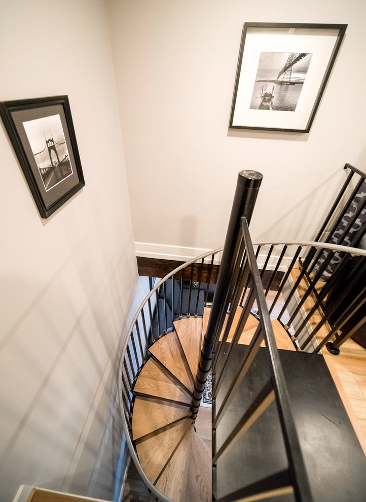 Staircase - small traditional wooden spiral metal railing staircase idea in Portland with metal risers