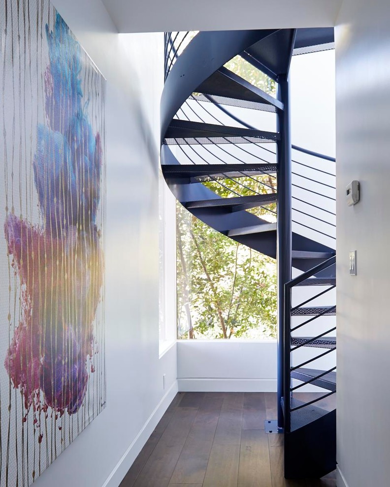 Inspiration for a small midcentury metal spiral staircase in San Francisco with open risers.