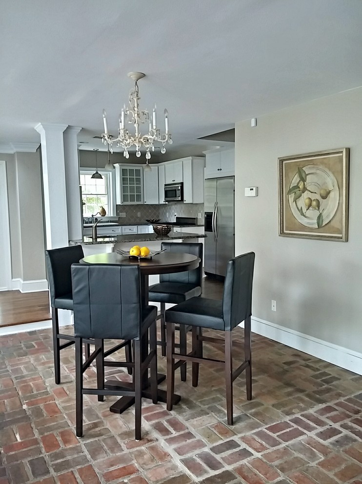 Mid-sized traditional separate dining room in Philadelphia with grey walls, no fireplace, brick floors and brown floor.