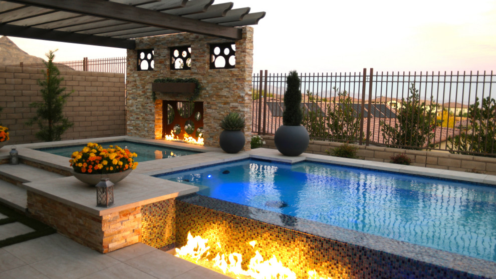 Inspiration for a mid-sized transitional backyard tile and rectangular aboveground pool landscaping remodel in Las Vegas