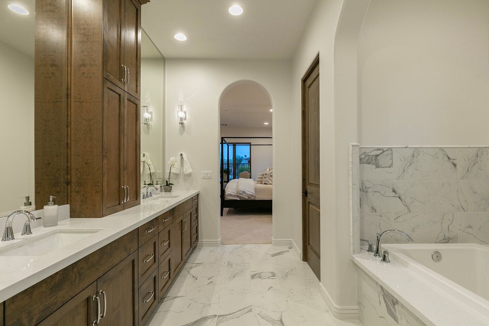 Alcove bathtub - large transitional master gray tile and marble tile marble floor and gray floor alcove bathtub idea in Phoenix with shaker cabinets, dark wood cabinets, a two-piece toilet, white walls, an undermount sink and quartz countertops